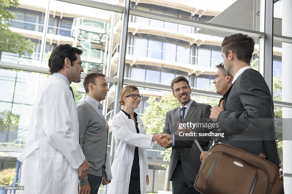 Doctors and businessmen meeting