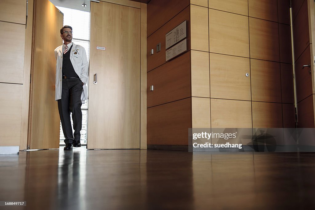 Doctor walking in office hallway