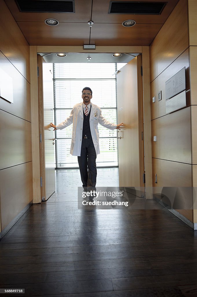 Doctor walking in office hallway