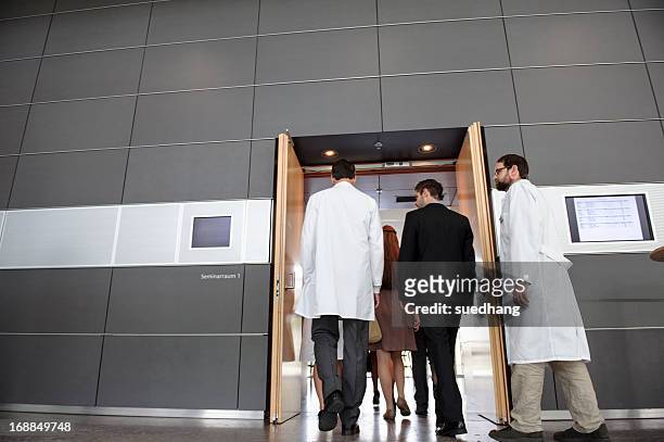 business people and doctors in office - entering hospital stock pictures, royalty-free photos & images