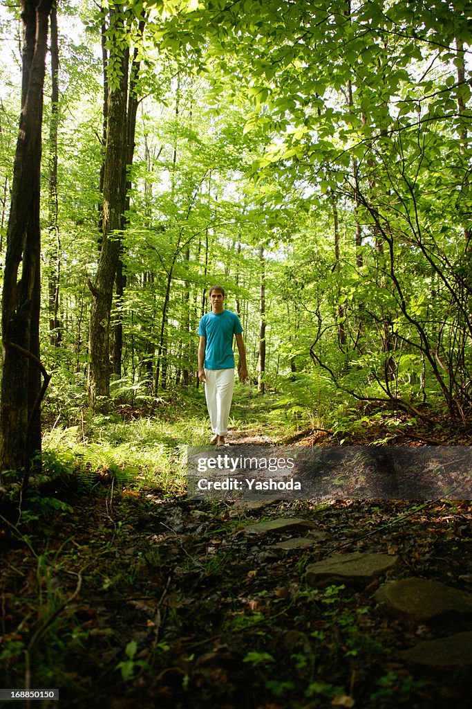 Man walking in forest