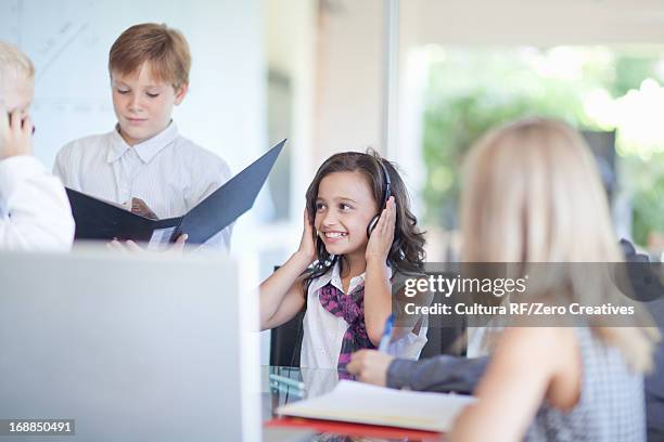 children playing business people at desk - rf business stock pictures, royalty-free photos & images