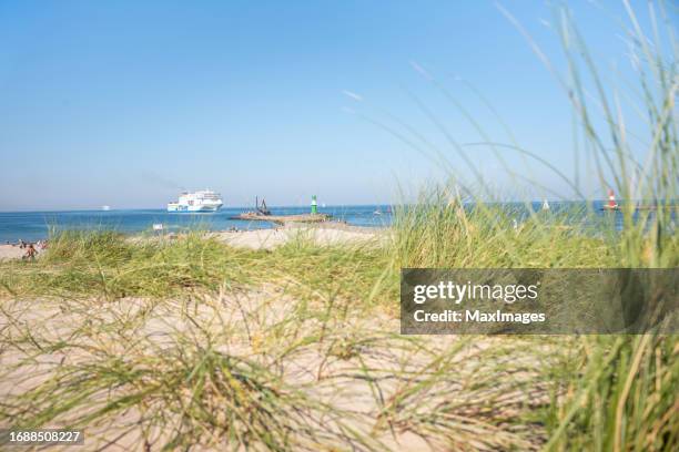 rostock warnemünde dunes beacon baltic sea summer - rostock stock pictures, royalty-free photos & images