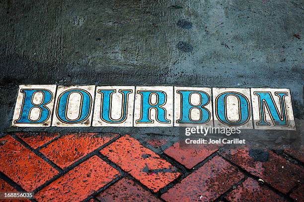 bourbon street on sidewalk in french quarter - bourbon street new orleans stock pictures, royalty-free photos & images