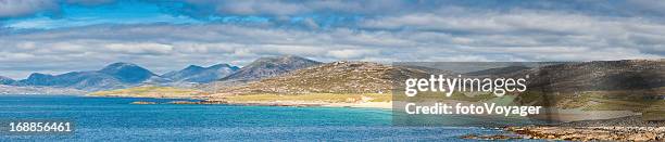 island beach blue ocean sunlit mountains panorama western isles scotland - beach panoramic stock pictures, royalty-free photos & images