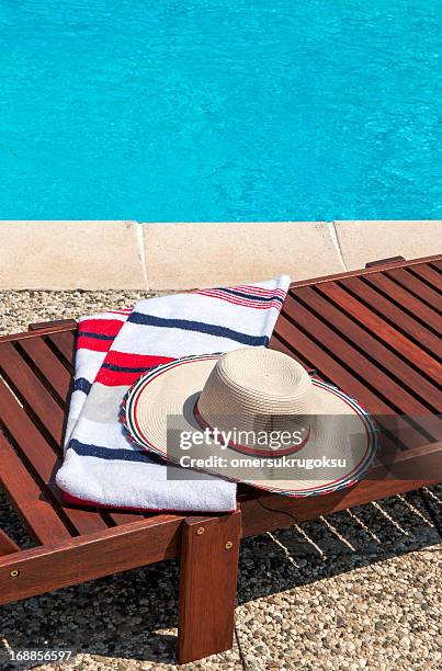 enjoying the pool - striped towel stock pictures, royalty-free photos & images
