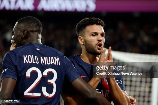 Paris Saint-Germain's Goncalo Ramos R celebrates his goal during the French League 1 football match between Paris-Saint Germain PSG and Olympique...
