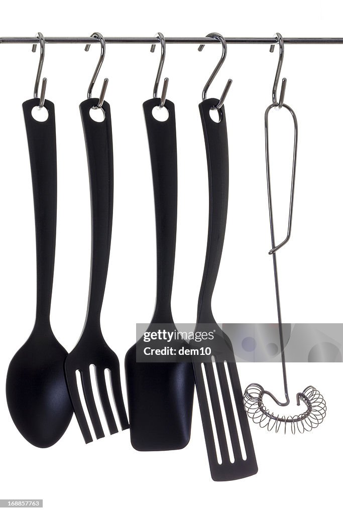 Cooking utensils hanging from hooks