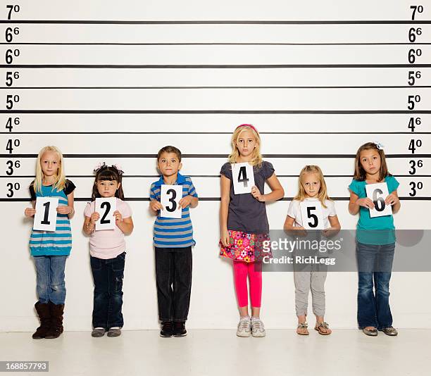 police line-up of six children - police line up stock pictures, royalty-free photos & images