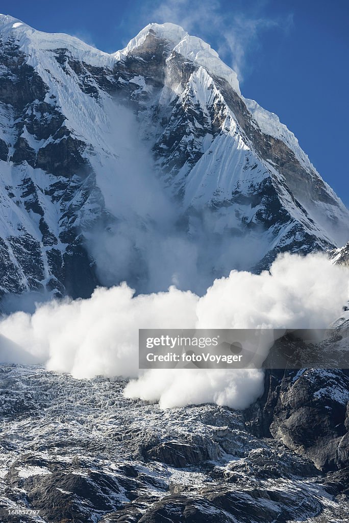 Avalanche thundering down Annapurna Himalayas mountains Nepal