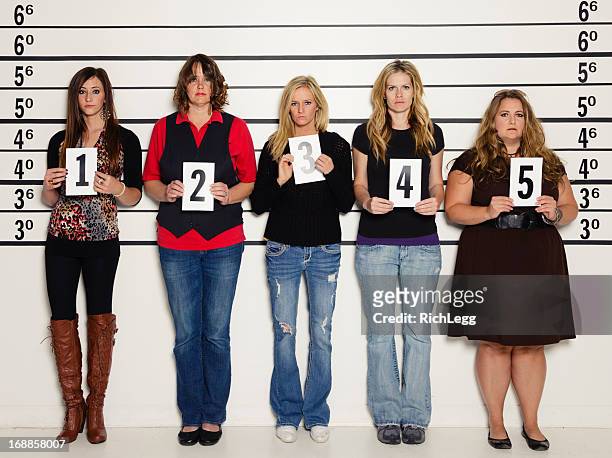 women in a police lineup - mug shot stock pictures, royalty-free photos & images