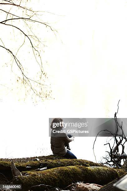 woman relaxing on log in nature - redwood shores stock pictures, royalty-free photos & images