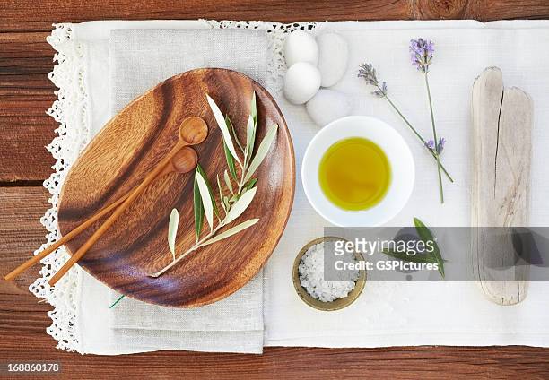 organic oil and salt with lavender on table cloth - feng shui house stock pictures, royalty-free photos & images