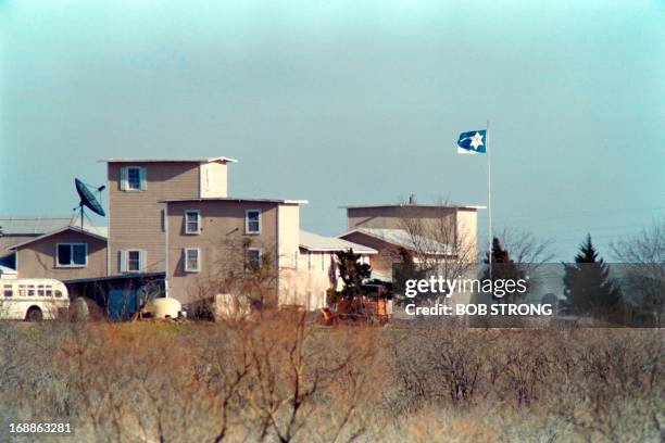 Cult flag flies over the Branch Davidian compound in Waco on March 08, 1993 . After a shootout in Waco in 1993 that killed four federal agents and...