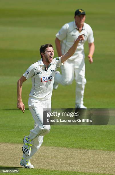 Harry Gurney of Nottinghamshire celebrates the wicket of Rory Burns of Surrey during day two of the LV County Championship division one match between...