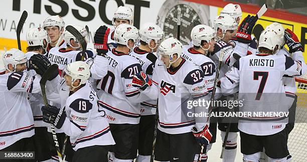 Players congratulate each other after defeating team Russia 8-3 during a quarter-final game Russia vs USA of the IIHF International Ice Hockey World...