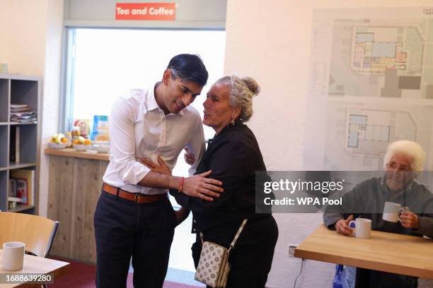 British Prime Minster Rishi Sunak meets members of the community attending a breakfast club at Wormley Community Centre on September 25, 2023 in...