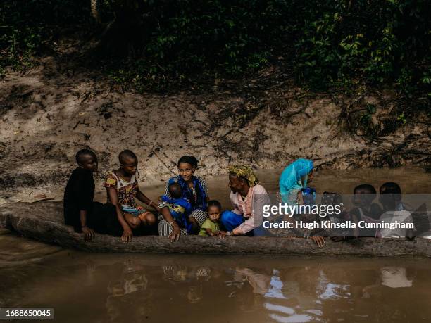 Group of Chadian nomads board a canoe to cross a river on September 21, 2023 in Niangara, Congo. Tensions between local Congolese communities and...