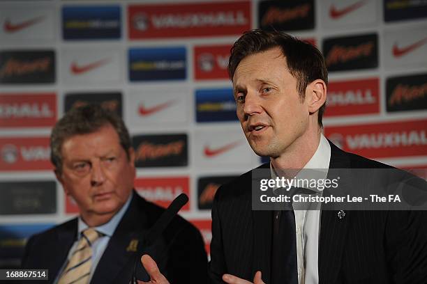 Chairman and Managaging Director of Vauxhall Motors, Duncan Alred speaks beside England Manager Roy Hodgson during a press conference to announce the...