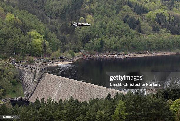 Lancaster bomber flies over Ladybower reservoir in the Derbyshire Peak District to mark the 70th anniversary of the World War II Dambusters mission...