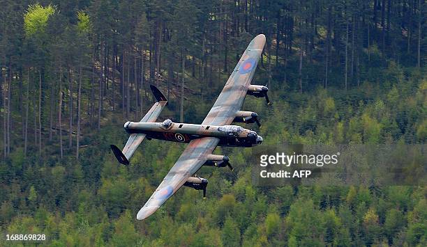 Lancaster bomber flies over Derwent Reservoir in Derbyshire, England on May 16 as part of events marking the 70th Anniversary of an air-raid on three...