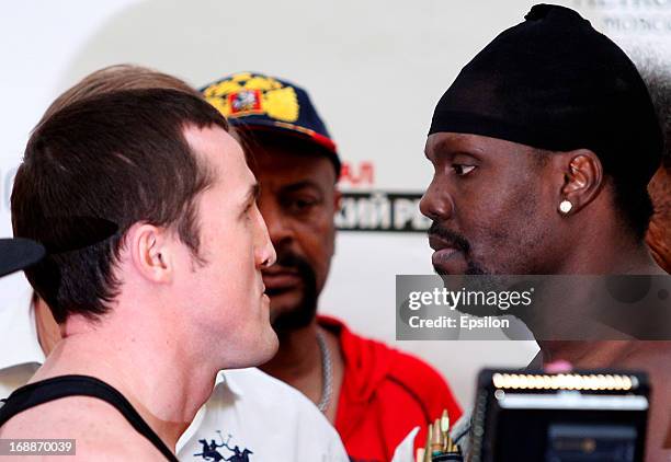 Denis Lebedev of Russia and Guillermo Jones of Panama face off during the official weigh-in for their WBA cruiserweight title bout at the...