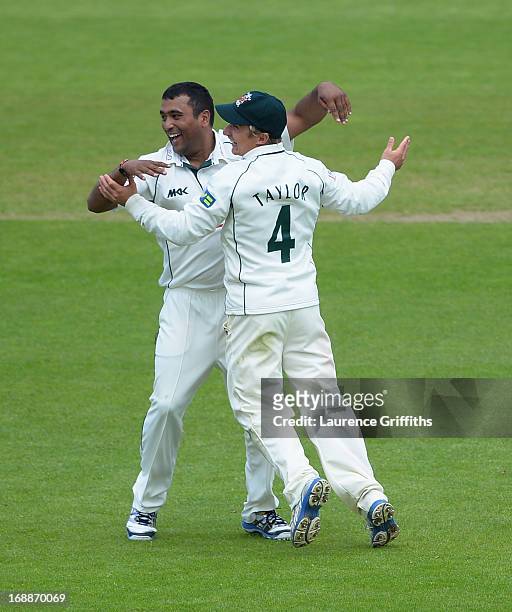 Samit Patel of Nottinghamshire is congratulated on the wicket of Gary Wilson of Surrey during day two of the LV County Championship division one...