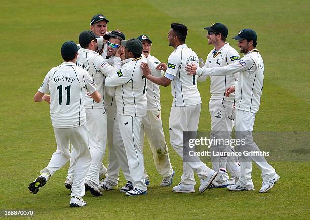 Michael Lumb of Nottinghamshire is congratulated on his catch to dismiss Arun Harinath of Surrey during day two of the LV County Championship...