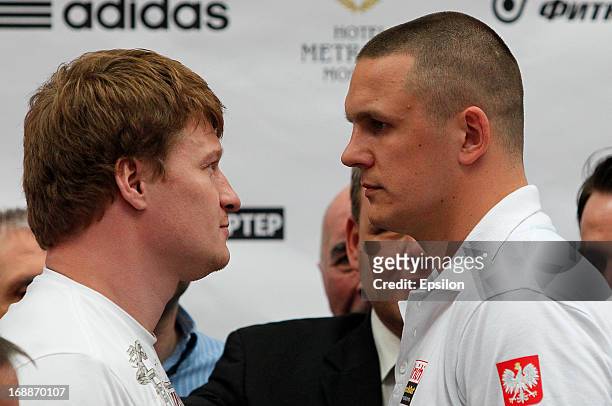 Alexander Povetkin of Russia and Andrzej Wawrzik of Poland face off during the official weigh-in for their WBA heavyweight title bout at the...