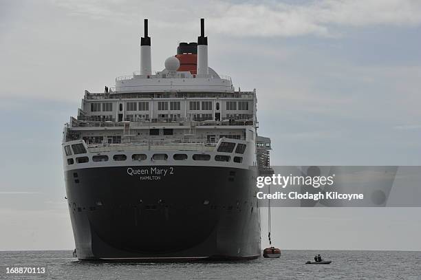 The RMS Queen Mary 2 is berthed one mile of the coast of Dublin on May 16, 2013 in Dublin Ireland The RMS Queen Mary 2, the world's largest ocean...