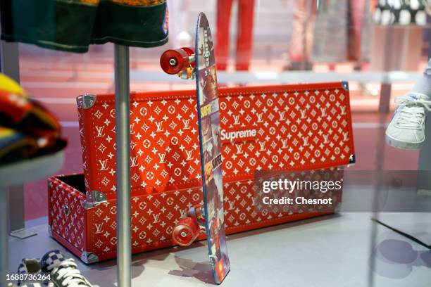 A trunk and a skateboard for Louis Vuitton and Supreme are displayed  News Photo - Getty Images