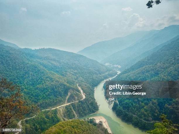 triveni - lover's meet - two rivers meeting point in darjeeling, india - valley side stock pictures, royalty-free photos & images