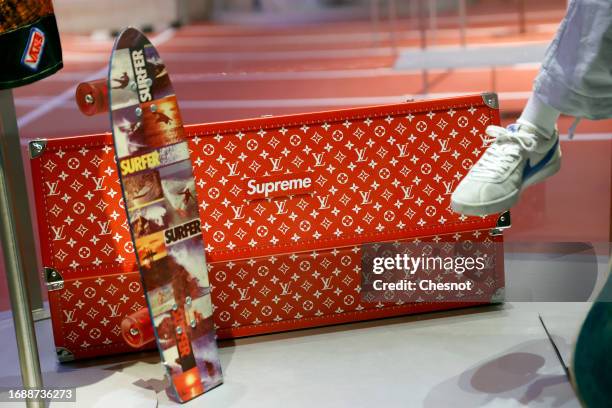 Trunk and a skateboard for Louis Vuitton and Supreme are displayed during "Mode Et Sport, D'un Podium A L'Autre" exhibition at Musee Des Arts...