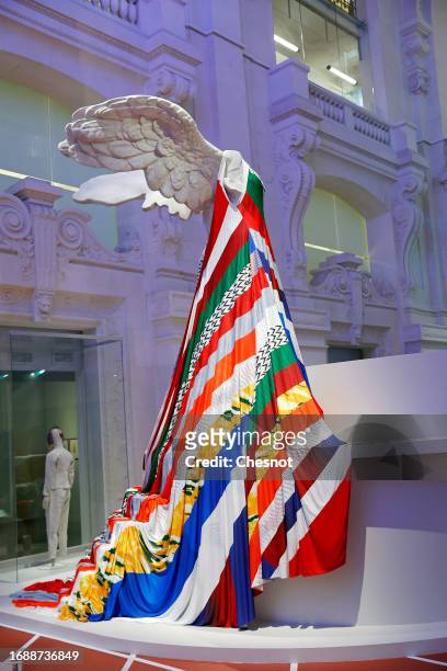 Goddess of Victory, copy of the Victory of Samothrace, dressed in a Koche fashion brand dress is displayed during "Mode Et Sport, D'un Podium A...