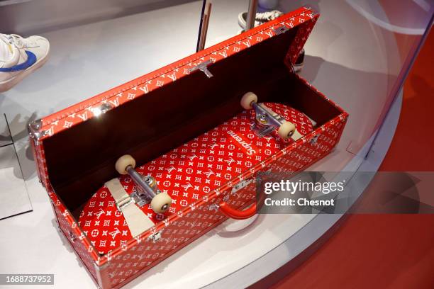 Trunk and a skateboard for Louis Vuitton and Supreme are displayed during "Mode Et Sport, D'un Podium A L'Autre" exhibition at Musee Des Arts...