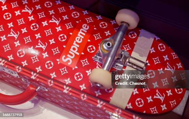 Trunk and a skateboard for Louis Vuitton and Supreme are displayed during "Mode Et Sport, D'un Podium A L'Autre" exhibition at Musee Des Arts...