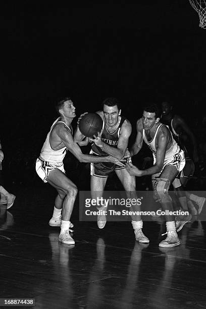 Jack Twyman of the Cincinnati Royals dribbles the ball against the Syracuse Nationals during a game played circa 1962 at the Onondaga War Memorial in...