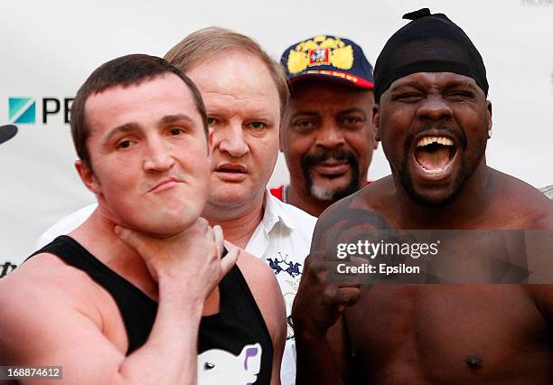 Denis Lebedev of Russia and Guillermo Jones of Panama pose during the official weigh-in for their WBA cruiserweight title bout at the Entertainment...