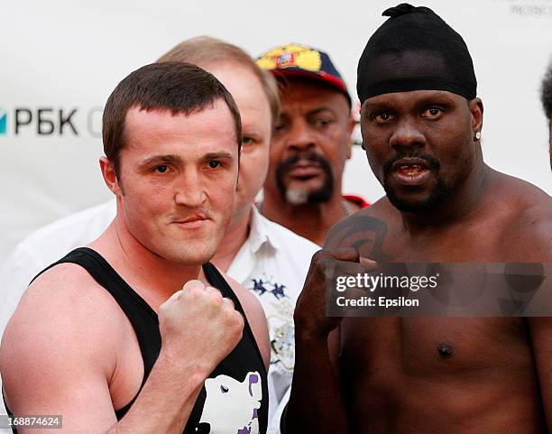 Denis Lebedev of Russia and Guillermo Jones of Panama pose during the official weigh-in for their WBA cruiserweight title bout at the Entertainment...