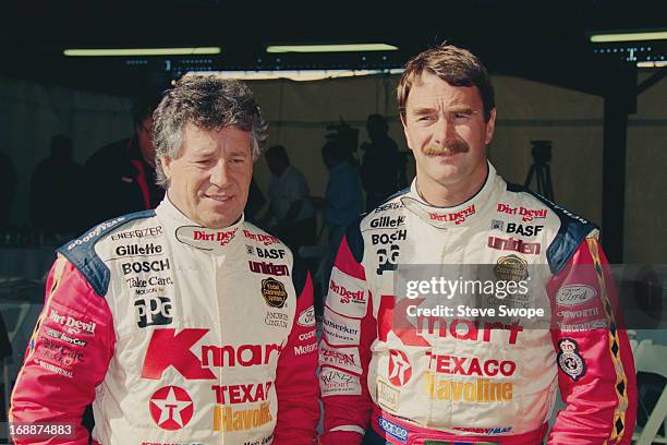 Racing drivers Mario Andretti and Nigel Mansell during testing of the new Lola T93/00 Newman Hass Indy car at Phoenix International Raceway, Phoenix,...