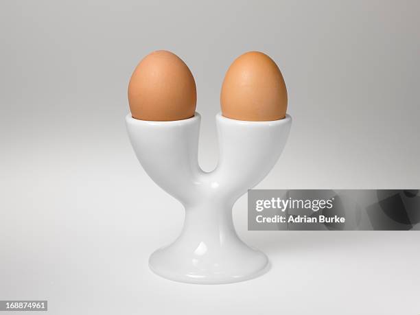 two boiled eggs. - egg cup stock pictures, royalty-free photos & images