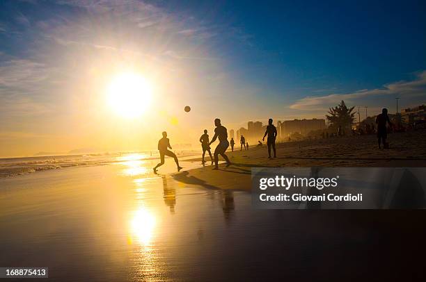 soccer on the beach - barra da tijuca stock pictures, royalty-free photos & images