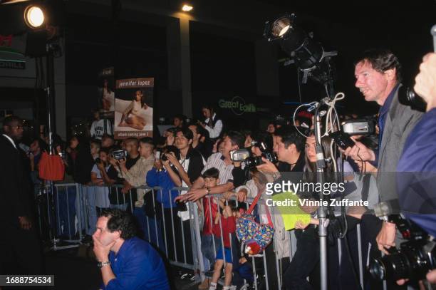 Fans await singer and actress Jennifer Lopez at the launch of her debut album "On the 6" at Wherehouse Music in Los Angeles, California, United...
