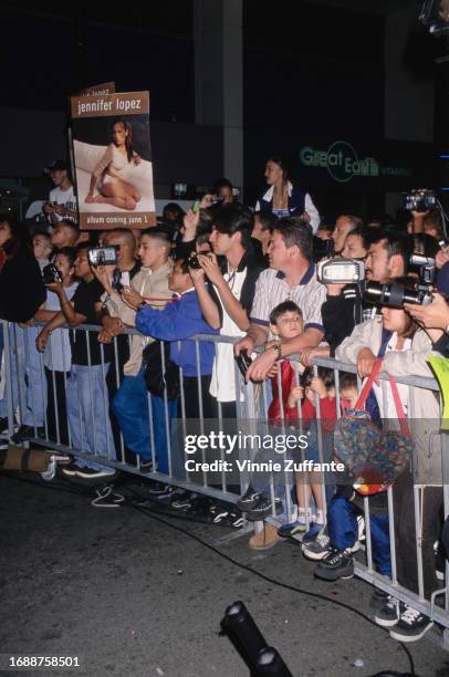 Fans await singer and actress Jennifer Lopez at the launch of her debut album "On the 6" at Wherehouse Music in Los Angeles, California, United...