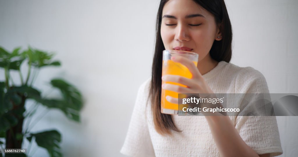 Young adult female and friends having fun celebrating together at home