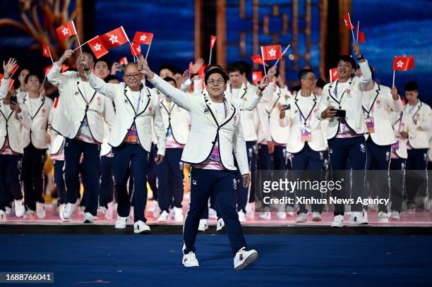 Kenneth Fok Kai-kong of delegation of Hong Kong, China parades into the Hangzhou Olympic Sports Center Stadium during the opening ceremony of the...