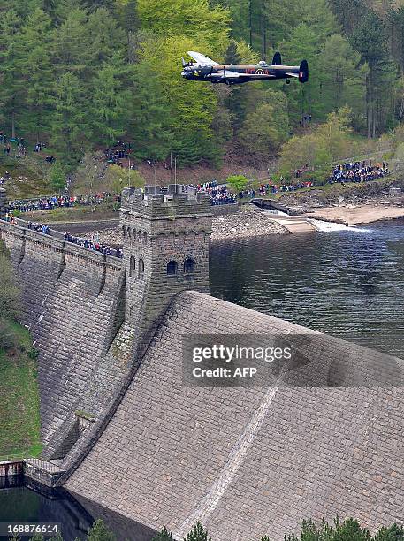 Lancaster bomber flies over Derwent Reservoir in Derbyshire, England on May 16 as part of events marking the 70th Anniversary of an air-raid on three...