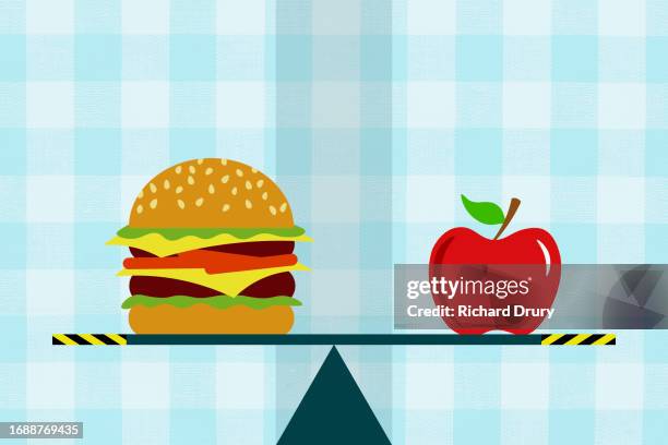 a burger and an apple on a seesaw - food and drink icon stock pictures, royalty-free photos & images