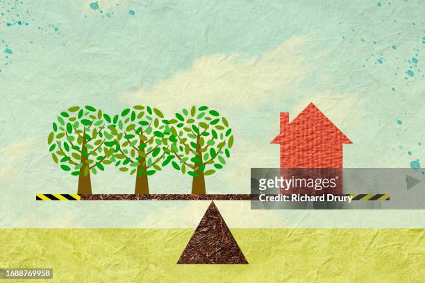 a house and three trees balanced on a seesaw - social comparison stock pictures, royalty-free photos & images