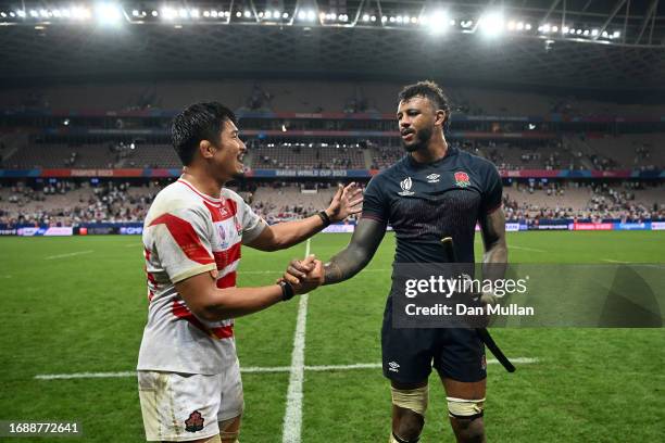 Kazuki Himeno of Japan shakes hands with Courtney Lawes of England after presenting him with a commemorative Samurai sword following the Rugby World...